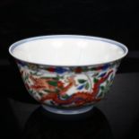 A Chinese Doucai 'dragon and phoenix' porcelain bowl, depicting 5-claw dragon chasing flaming pearl,