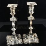 A pair of George V silver table candlesticks, with removeable sconces, by George Edward & Sons,