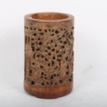 A Chinese bamboo brush pot, relief carved and pierced decoration with character mark, height 13cm