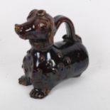 An 18th/19th century treacle glaze pottery figural Dachshund dog jug, height 18cm