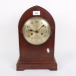 A German oak 8-day lancet-top mantel clock, silvered dial with Arabic numerals, and movement