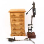 Miniature pine chest of drawers containing fishing fly tying tools, height 32cm, and 2 clamps