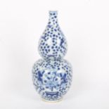 A Chinese blue and white double-gourd vase, figural and floral decoration with jars, height 29cm