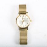 GARRARD - a 9ct gold mechanical bracelet watch, on gold plated expanding strap, working order