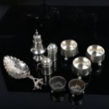 A small Dutch silver caddy spoon, a set of Victorian silver salts, pepperettes etc