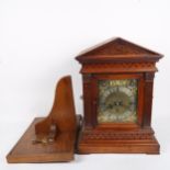 An early 20th century German oak architectural 8-day chiming bracket clock, brass dial with silvered