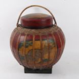 An Oriental lacquered caned and painted food carrying vessel, height 30cm