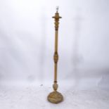 A turned wood and gilt standard lamp, height to top of bayonet fitting 171cm