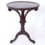 A hardwood circular lamp table, on carved tripod base, W45cm, H76cm