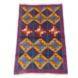 A red ground Beluchi rug, 118cm x 77cm