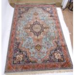 A red and blue ground Persian carpet, 277cm x 183cm