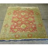 A green ground Afghan design carpet, 395cm x 240cm (viewing by appointment only)