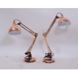 A pair of copper effect anglepoise lamps