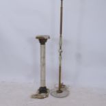 A gilt-metal and onyx turned standard lamp, height to top of bayonet fitting 147cm, and an onyx