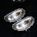 A pair of George V silver bon bon dishes, with scalloped rims, by Wilson & Sharp, hallmarks