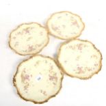 A set of 4 Limoges porcelain plates with gilded shaped rims, 23.5cm