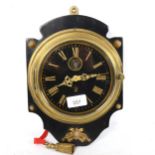 A brass-cased circular dial bulkhead clock, height 28cm, not currently working