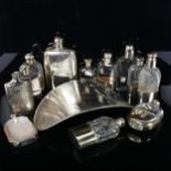 A quantity of silver plated spirit flasks, including jumbo and hot water bottle belly warmer example