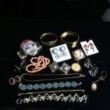A tray of mixed costume jewellery, to include a pair of Liberty pewter clip-on earrings, a coral