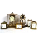 A brass 400-day clock, with glass dome on plinth, height 24cm, another, 3 carriage clocks, and an