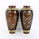 A pair of Japanese cloisonne enamel vases, exotic bird and butterfly decoration, height 25cm (some