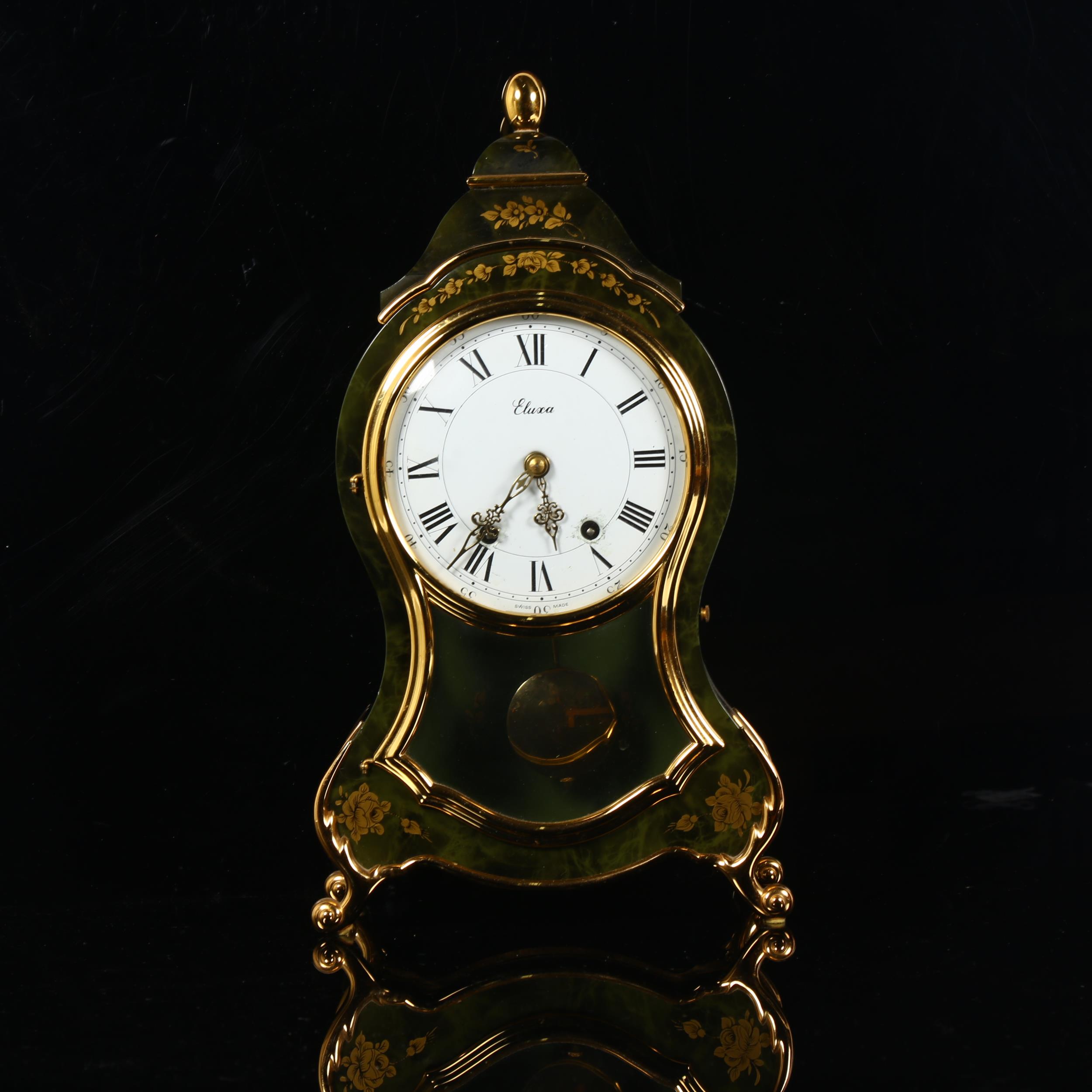 A reproduction Eluxa 8-day mantel clock, case height 37cm, with key and pendulum