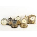 5 x 400-day clocks under glass domes, another, and an alarm clock, height 11cm