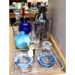 A decanter, a scent bottle, and other decorative glassware