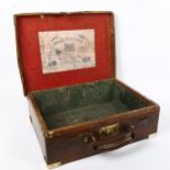 A Hardy Brothers 'Hold All' leather-bound fishing tackle case, with brass mounts and lock, 40cm x