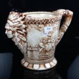 A Staffordshire Canada Confederation jug, with coat of arms and mask spout, height 26cm