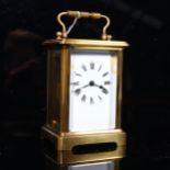 A brass-cased carriage clock, case height 11cm, working order, no key