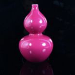 A Chinese pink ground porcelain double-gourd vase, 6 character mark on base, height 23cm