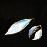 DAVID ANDERSEN - a Norwegian sterling silver-gilt and blue enamel leaf design brooch, and a pair
