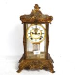 A Victorian gilt-brass 4-glass 8-day mantel clock, white enamel dial with Roman numeral hour markers
