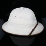 A Robinson & Co Limited pith helmet, in tin travelling case