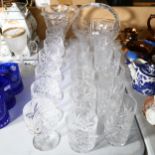 A set of 6 cut-crystal Brandy balloons, matching Whisky glasses and tumblers, jug and a glass basket