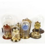 Various clocks and glass domes, including Kundo, and Schatz