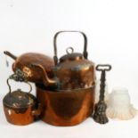 A large 19th century copper pan with iron handle, a lion paw design door stop, 2 copper kettles,