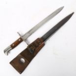 A First World War Period German Neuhausen bayonet and scabbard, no. 140632, blade length 30cm