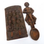 A relief carved oak religious wall panel, and a similar stained pine Don Quixote spoon, length