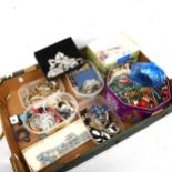 A tray of mixed costume jewellery, brooches etc