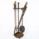 A set of First World War Period bayonet fireside tools, on cast-iron stand