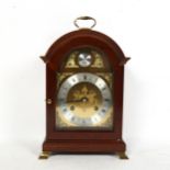 A reproduction mahogany dome-top bracket clock, by Comitti of London, with movement striking on a