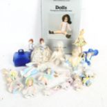 A group of porcelain half dolls, a pin cushion doll, height 8.5cm, and a book