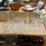 A large quantity of drinking glasses, including Waterford Claret, mallet decanters etc