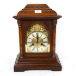 A mahogany-cased architectural 8-day mantel clock, brass dial with movement striking on 3 gongs,