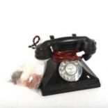 An early 20th century Siemens black Bakelite dial telephone, working order