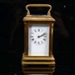 A miniature brass-cased carriage clock, case height 7cm, untested, no key