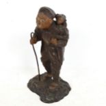 A Japanese painted spelter sculpture, man with monkey, stamped on base, height 24cm