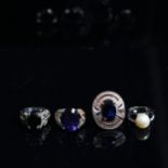 3 sterling silver and blue stone set dress rings, and another (4)